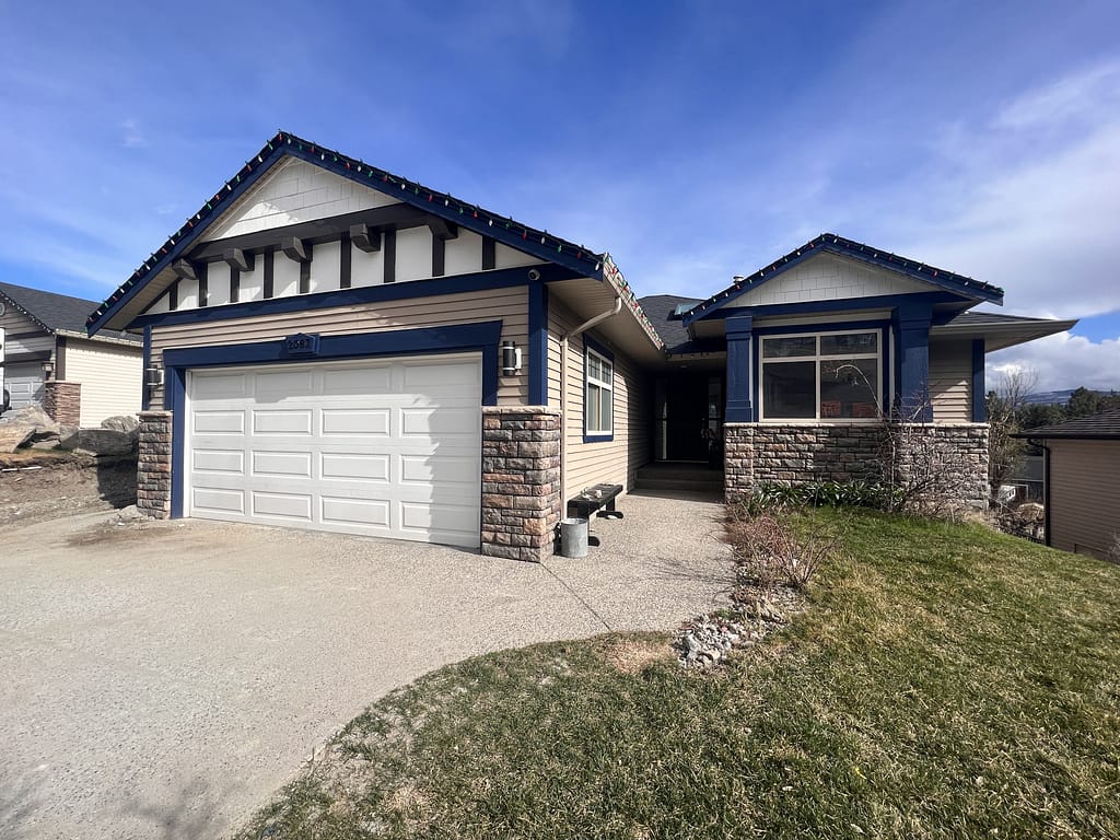 Craftsman style house with patchy paint job