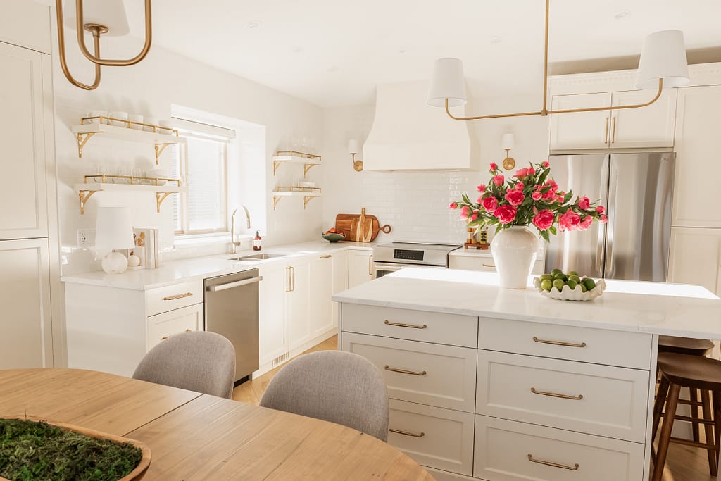 transitional cream kitchen, plaster hood, open brass shelves, tile to ceiling
