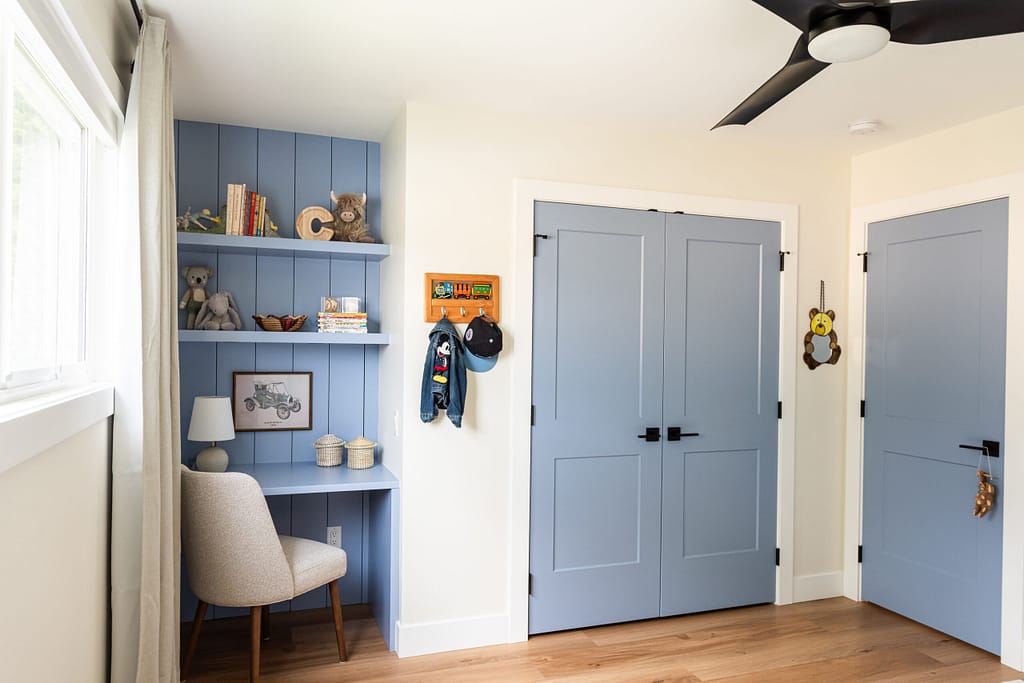 custom blue built in child's desk, shiplap detail, matching closet door