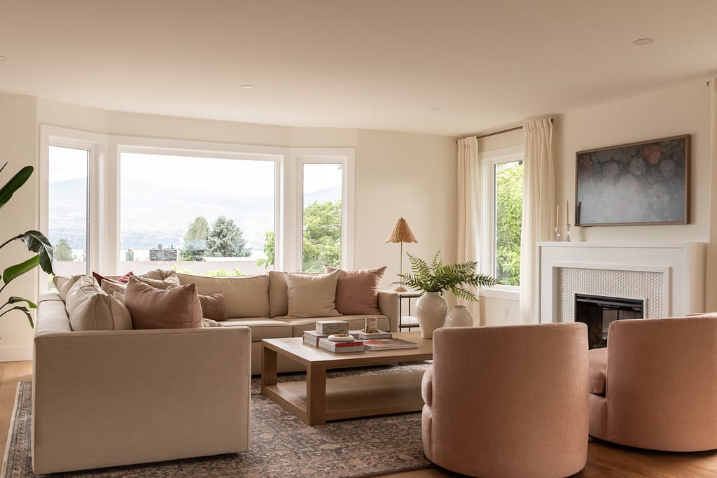 pink living room, swivel chairs, fireplace