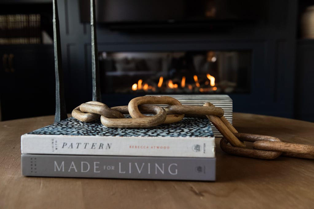 After photo of modern living room with linear fireplace and custom built-in cabinetry