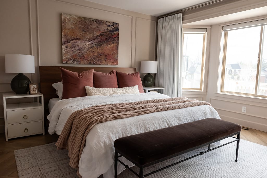 blush bedroom with abstract art pink green purple