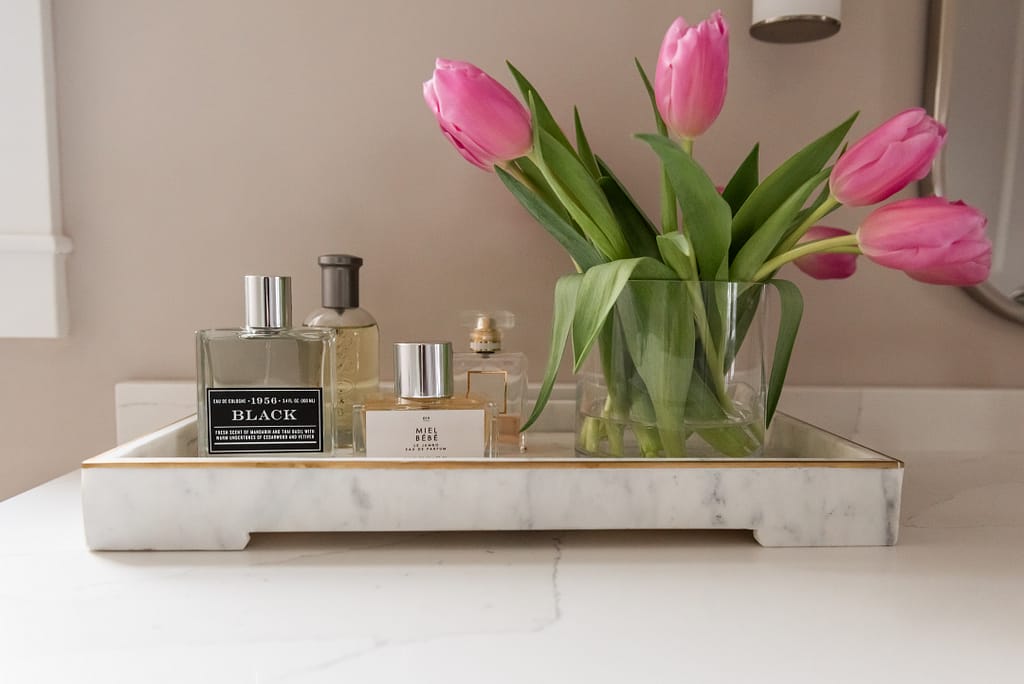 bathroom countertop styling, perfume, pink tulips