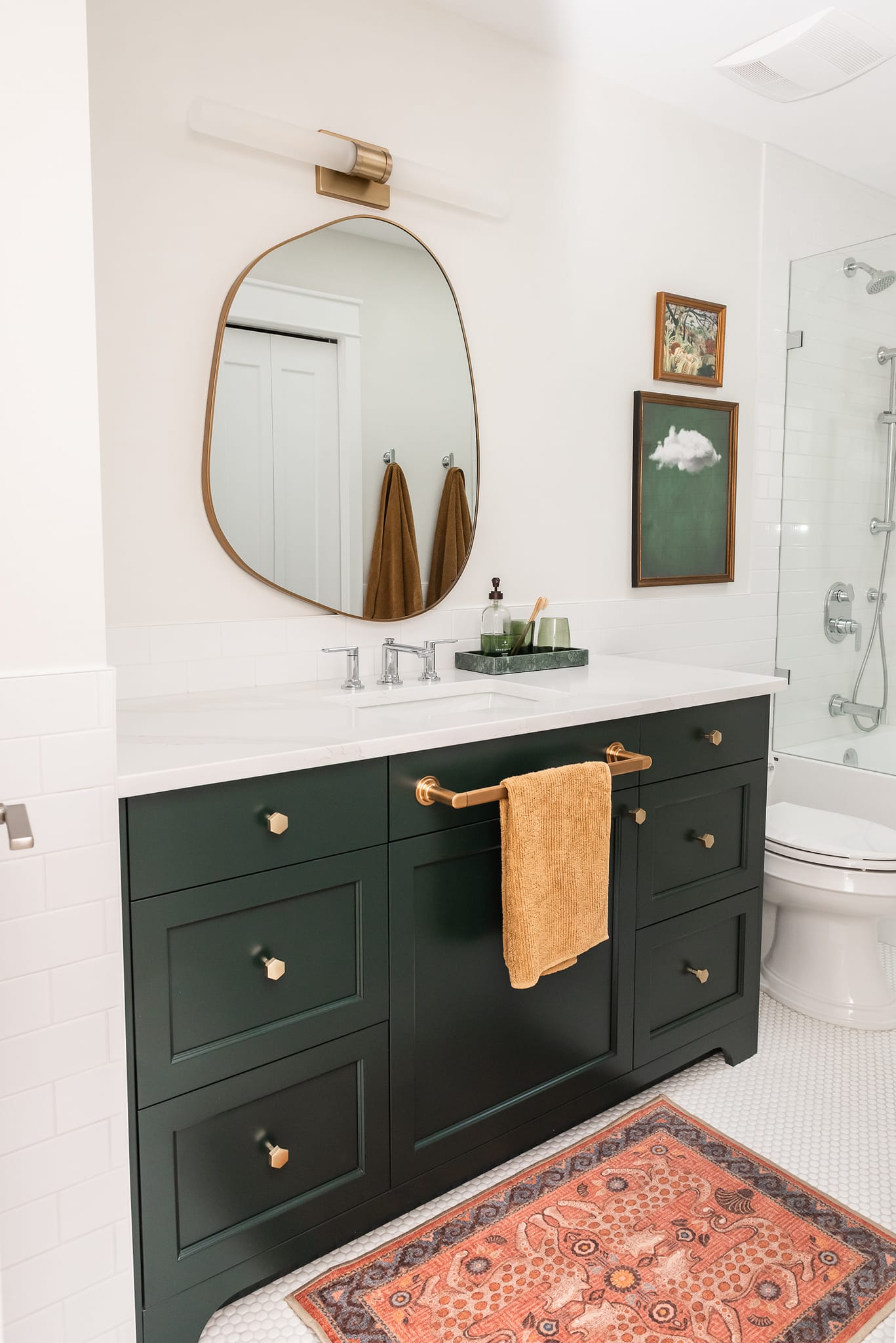 kids bath, boys bathroom, green vanity, irregular mirror, subway tile halfwall