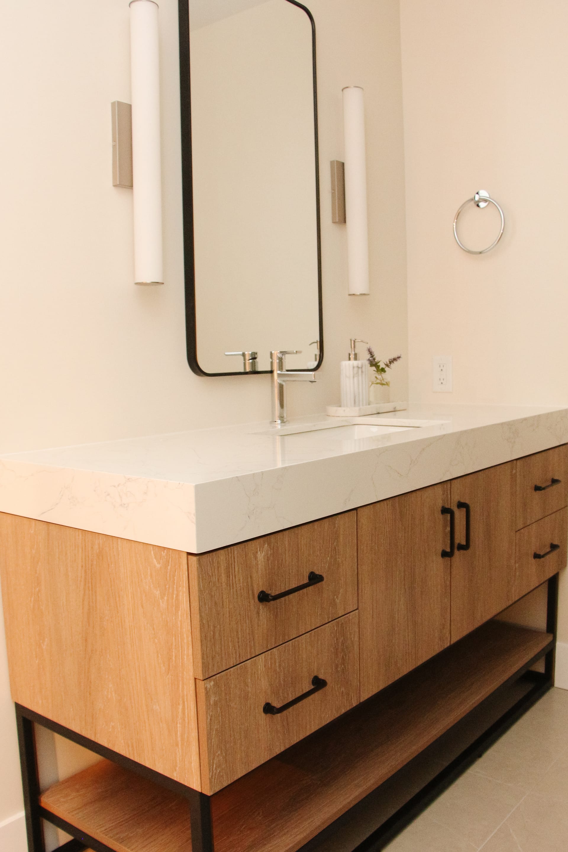 A MCM vanity in a warm basement bathroom