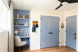custom blue built in child's desk, shiplap detail, matching closet door