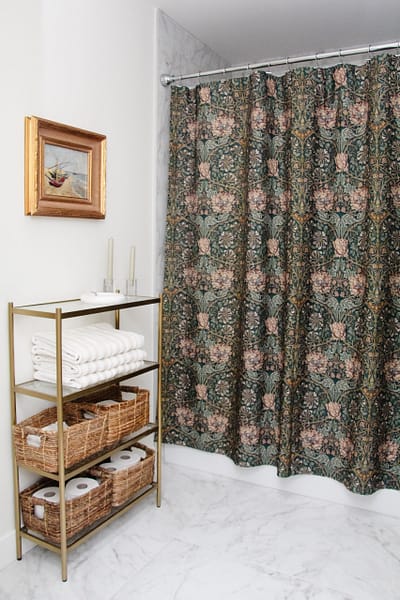 contemporary kids bathroom with green shower curtain and gold accents