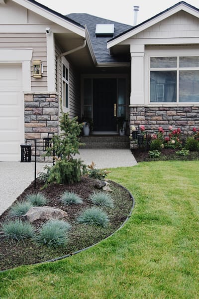 exterior update landscaping and fresh paint on a 2000s home