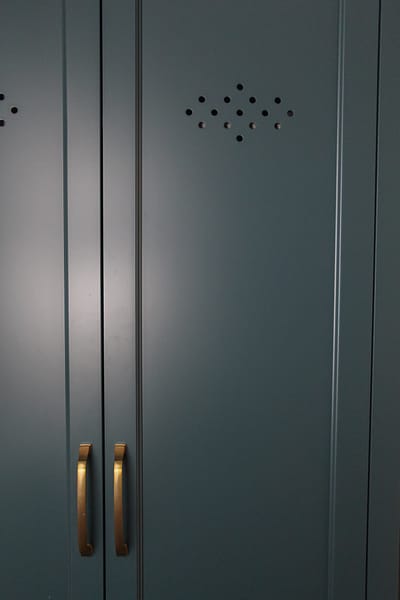 custom vent holes in cabinetry locker blue