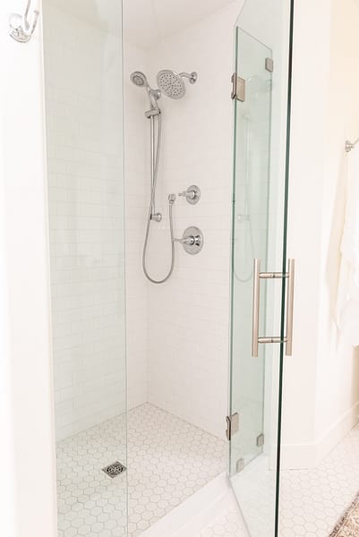 Subway tile shower hex floor tile white bathroom