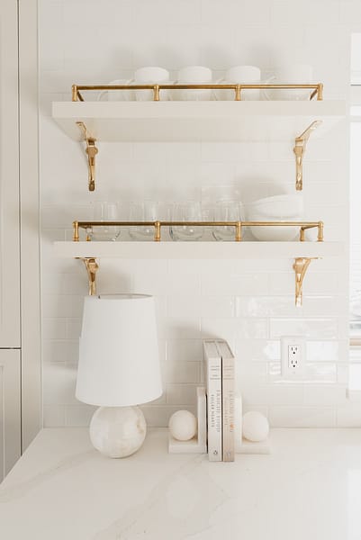 traditional brass shelves cream kitchen subway tile