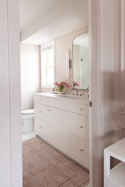 pink bathroom, white vanity