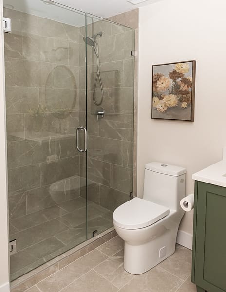 basement bathroom with green vanity and walk in shower