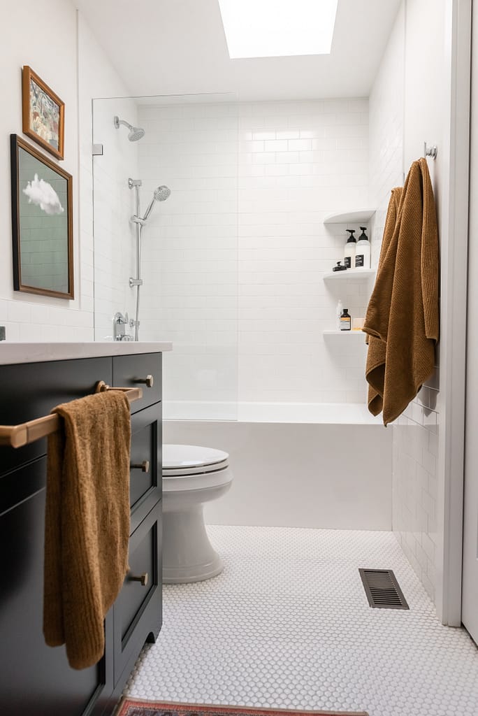green vanity, timeless bathroom, colourful bathroom, green vanity, subway tile half wall