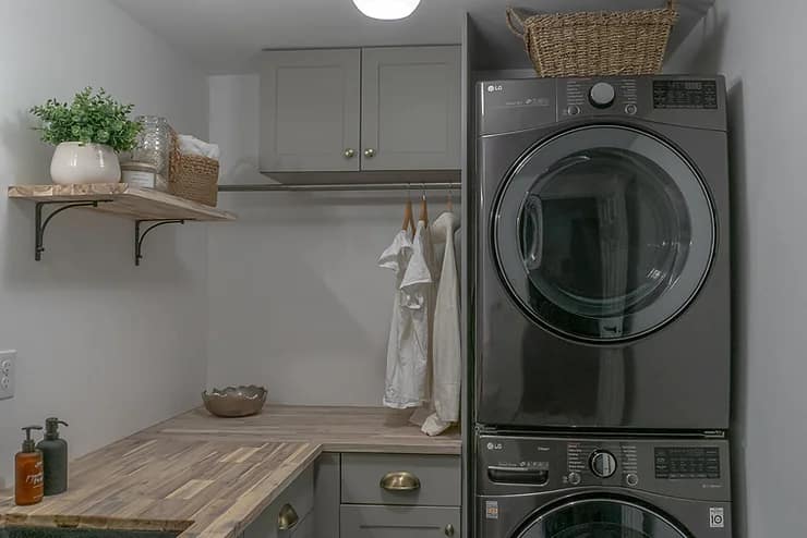 sage green laundry room, butcher block counter, laundry bathroom