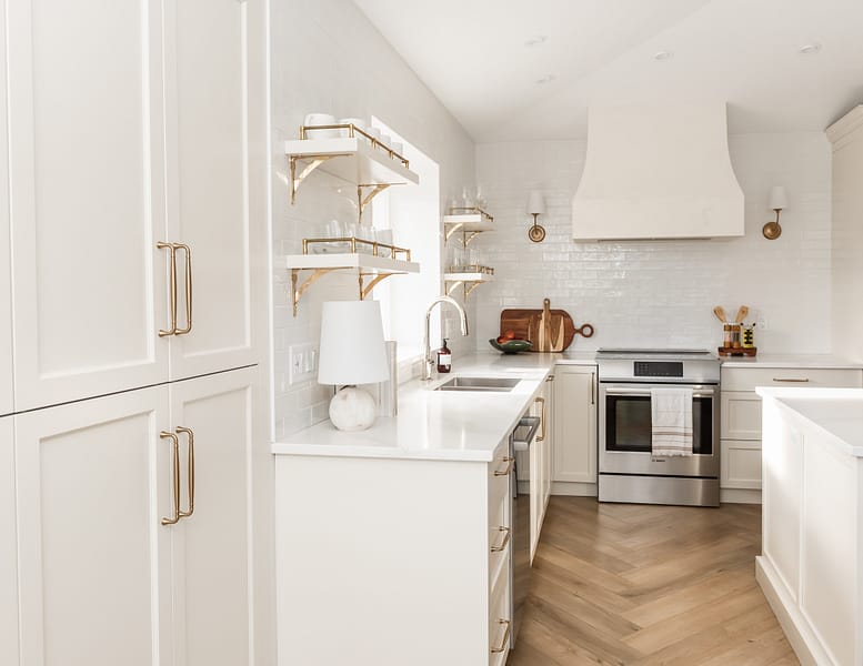 transitional cream kitchen, plaster hood, open brass shelves, tile to ceiling