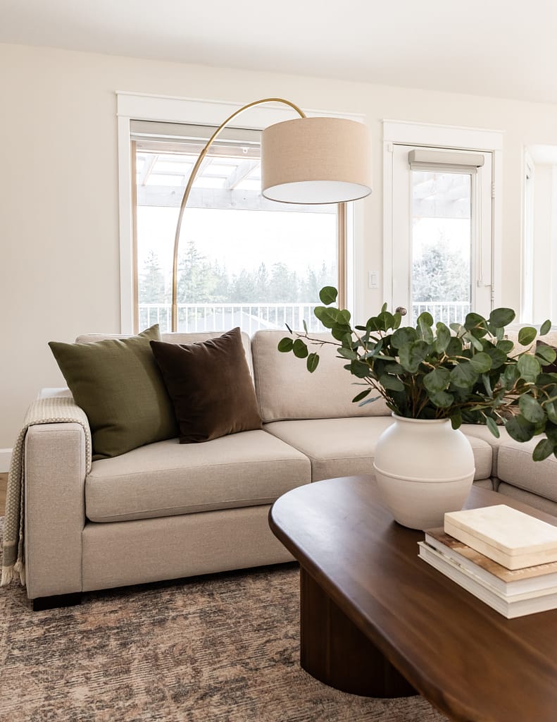 sectional with pillows and coffee table styling