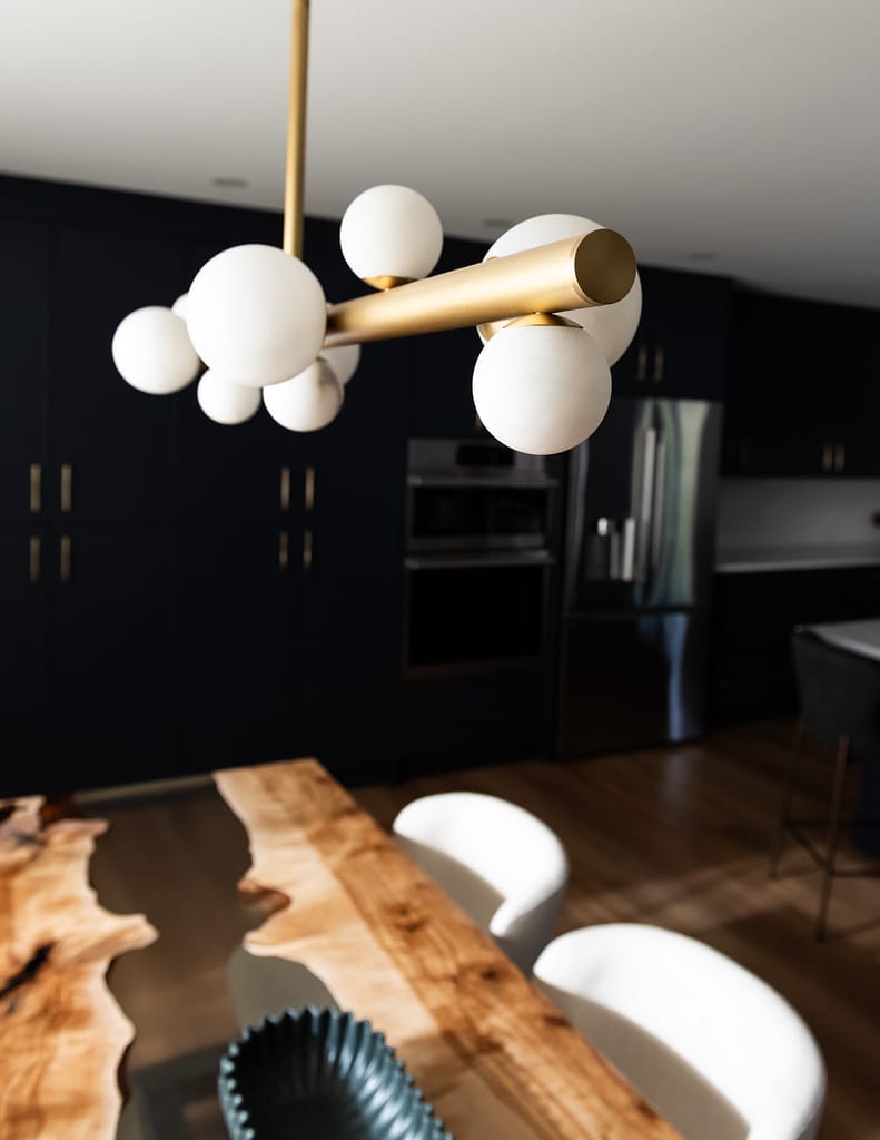 Custom navy pantry wall with floor-to-ceiling cabinetry for high-function family kitchen storage