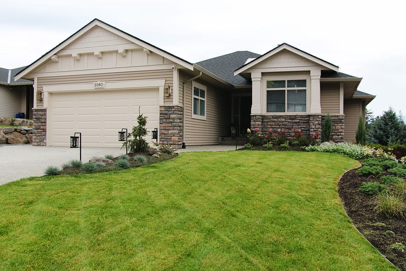 exterior update landscaping and fresh paint on a 2000s home