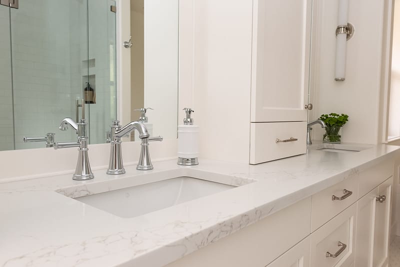 Traditional double white vanity with nickel scone and vanity tower
