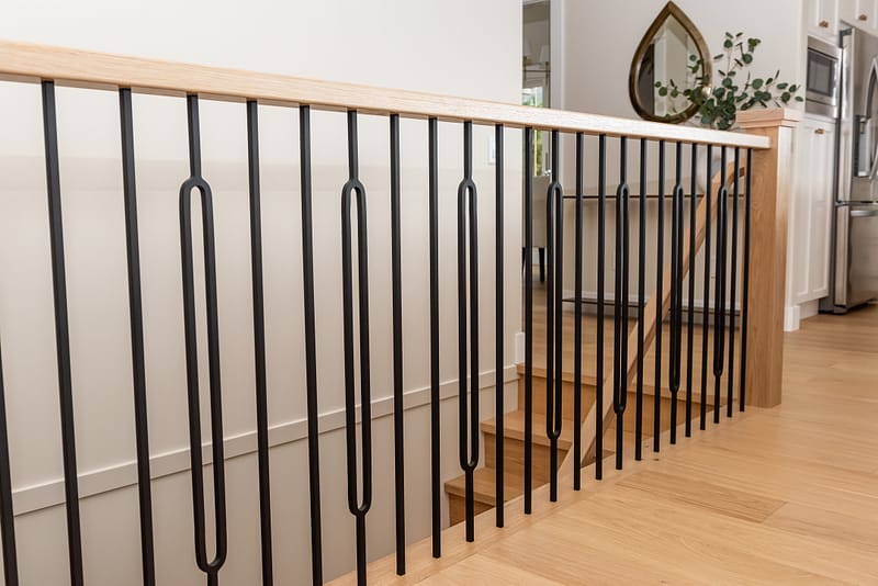 White oak railing with round black spindles