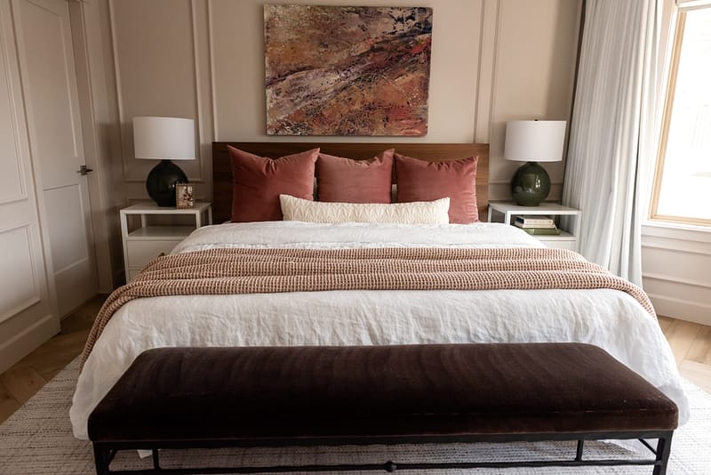 blush bedroom with abstract art pink green purple