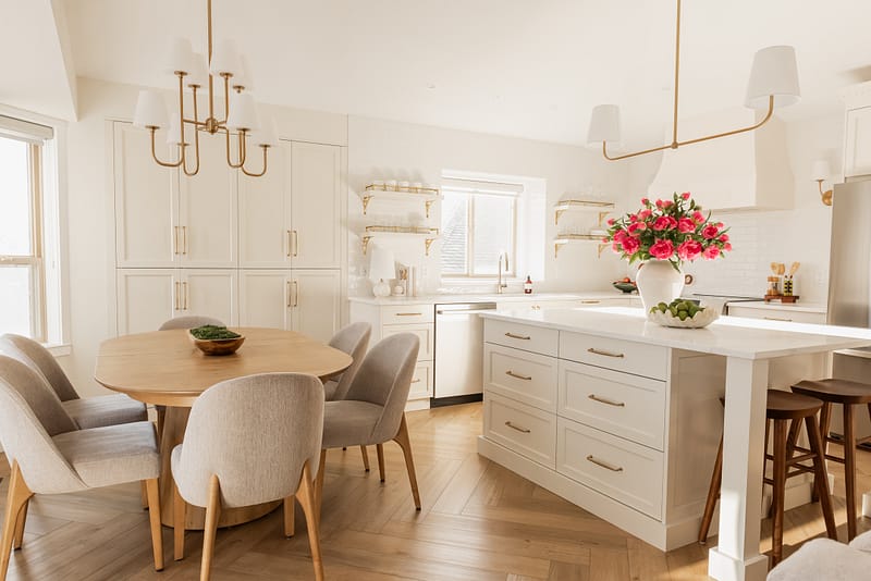 transitional cream kitchen, plaster hood, open brass shelves, tile to ceiling