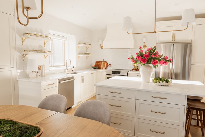transitional cream kitchen, plaster hood, open brass shelves, tile to ceiling