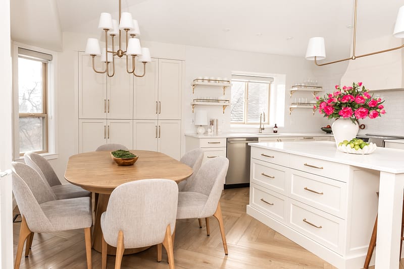 transitional cream kitchen, plaster hood, open brass shelves, tile to ceiling