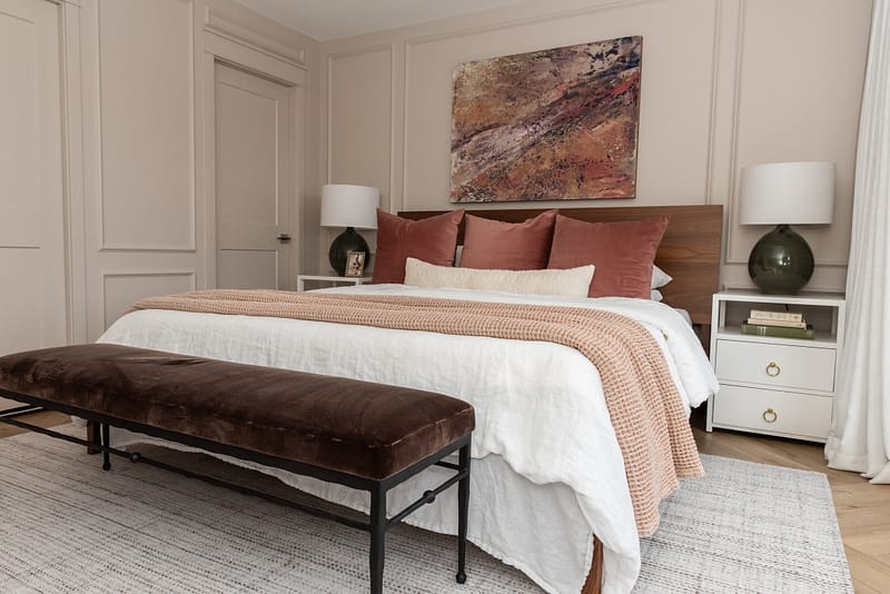 blush bedroom with abstract art pink green purple