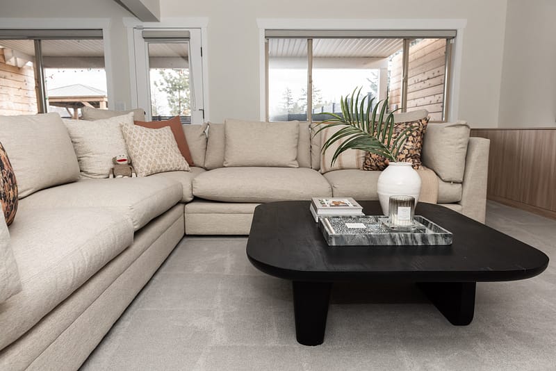 basement games room, sectional and coffee table styled