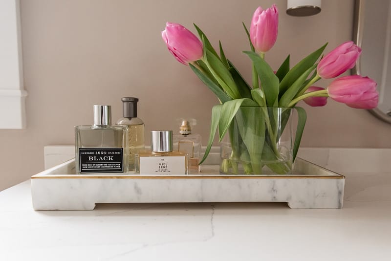 bathroom countertop styling, perfume, pink tulips