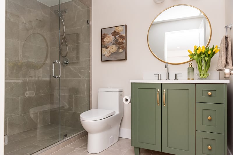 basement bathroom with green vanity and walk in shower